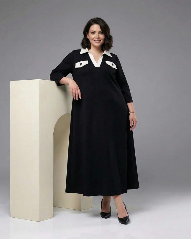 Черна официална макси рокля в А-силует с контрастна бяла яка и декоративни джобчета, заснета в цял ръст.