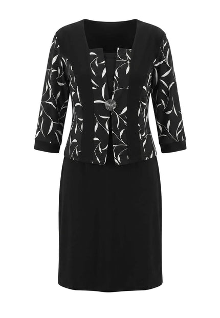 Черна официална рокля големи размери с бял листен мотив, 3/4 ръкави и брошка, заснета отпред на бял фон.