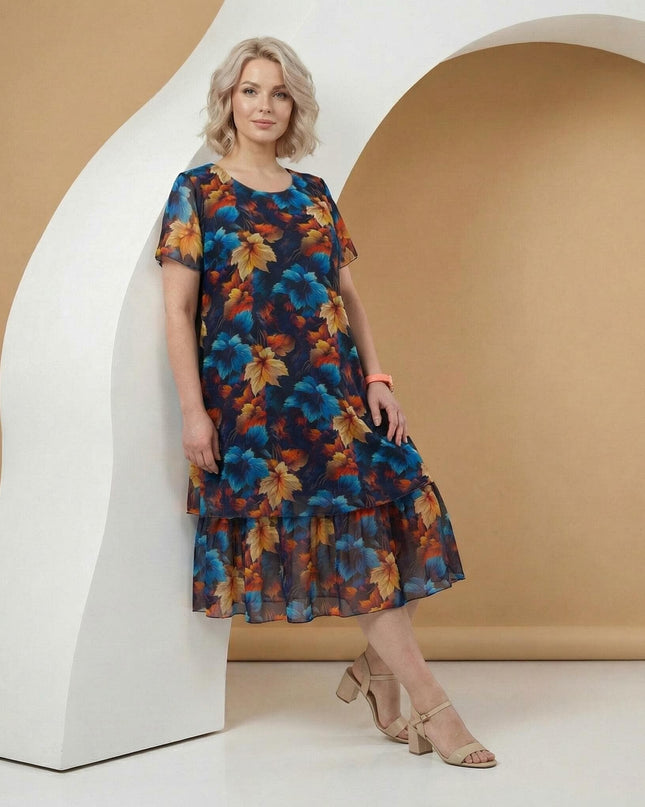 Официална тъмносиня макси рокля от шифон с многоцветен принт на листа и прозрачни ръкави, снимана в цял ръст.