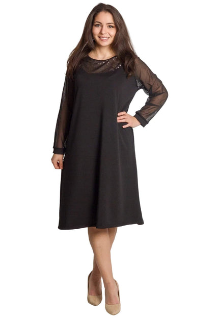 Стилна официална черна рокля с тюлени ръкави и блестящи пайети, представена от модел в цял ръст.