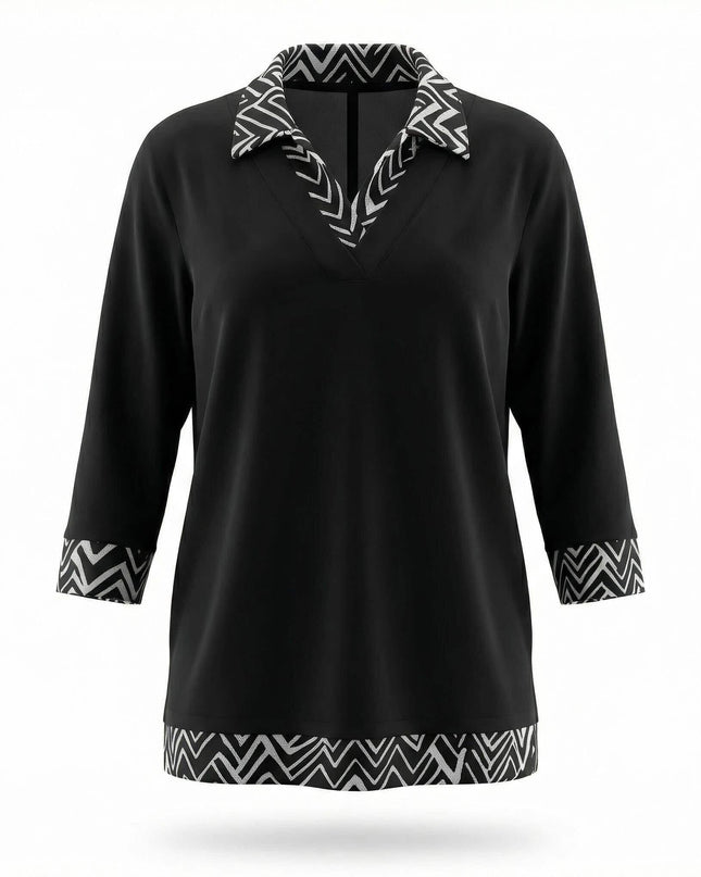 Официална черна туника големи размери с яка, маншети и подгъв в черно-бял зигзаг десен, заснета отпред на бял фон