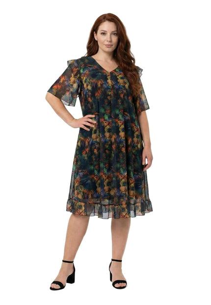 Официална макси рокля от цветен шифон с ефектен ръкав и волани в долната част, заснета в цял ръст на бял фон.