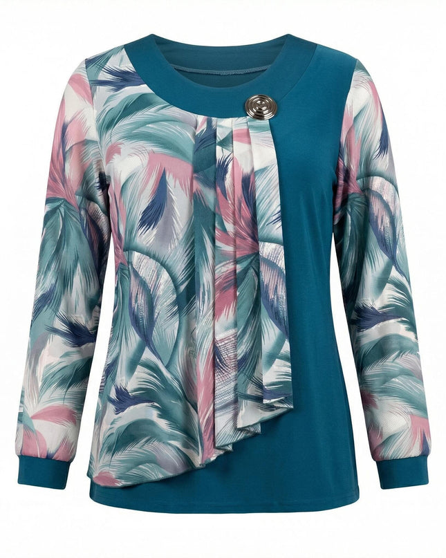 Официална макси туника в цвят петрол с ефирен шифон на абстрактни шарки и метална брошка, заснета в цял ръст отпред.