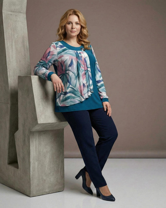 Официална макси туника в цвят петрол с ефирен шифон и флорални мотиви, представена в цял ръст върху модел.