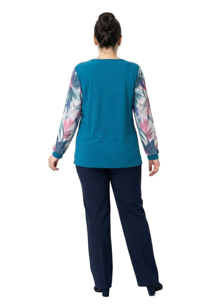 Официална макси туника в цвят петрол, заснета отзад в цял ръст, показваща изчистения гръб и ефирните ръкави с флорален мотив.