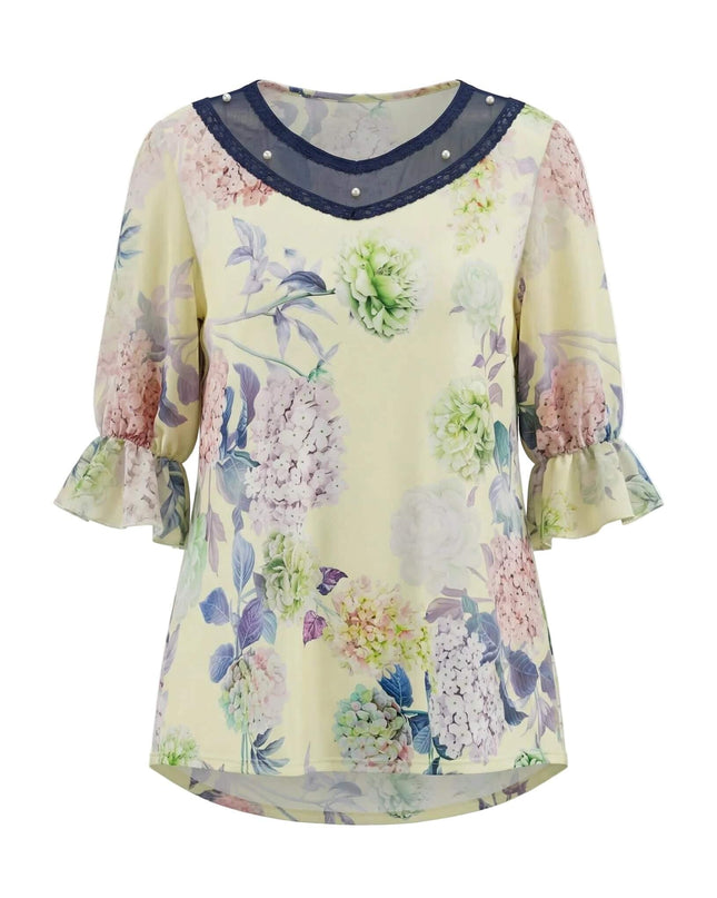 Официална разкроена макси туника в жълто с флорален принт и деколте с тъмносин тюл и перли, заснета отпред на бял фон.